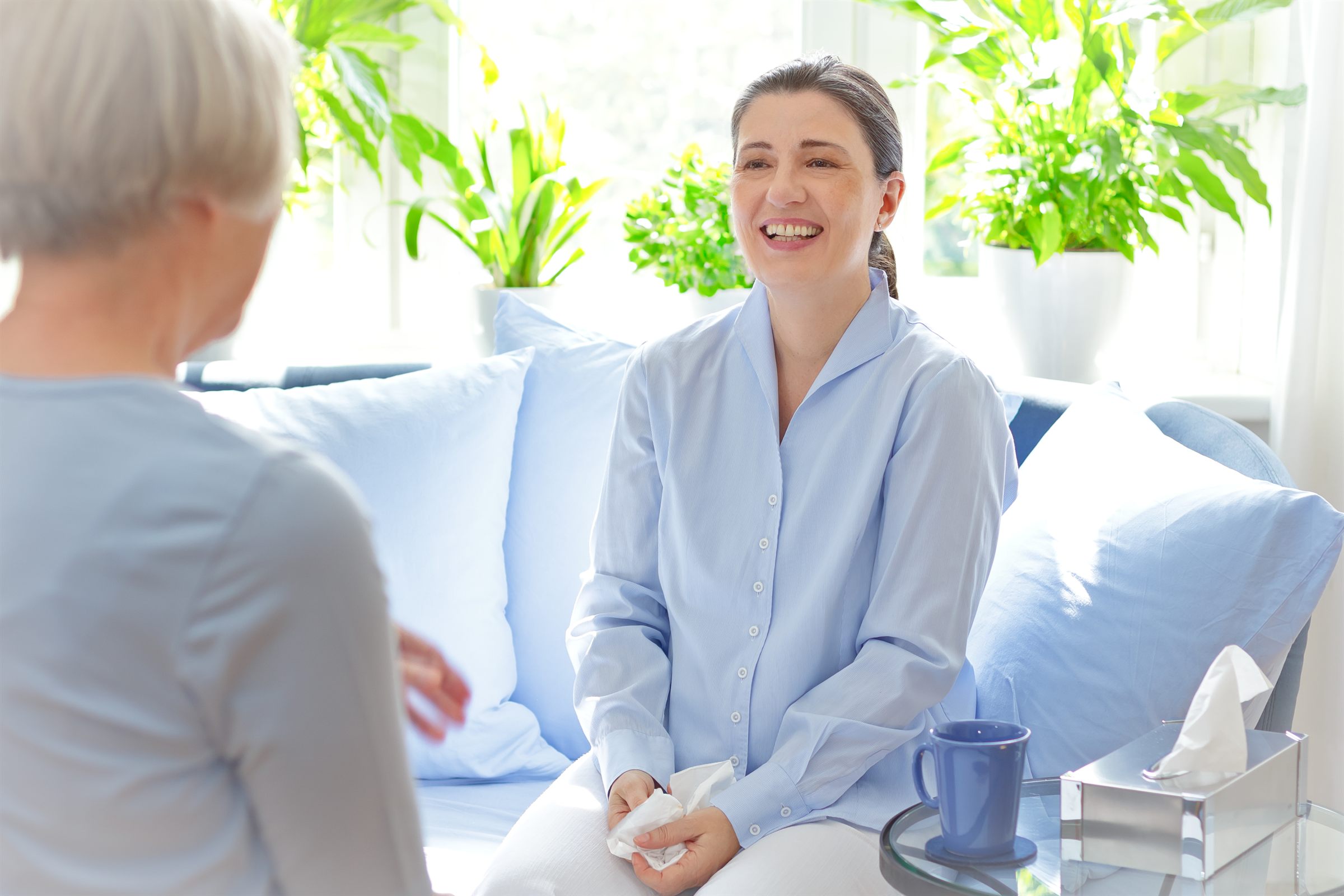 Psychologist smiling during an in-person consultation